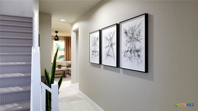 hall with light tile patterned flooring