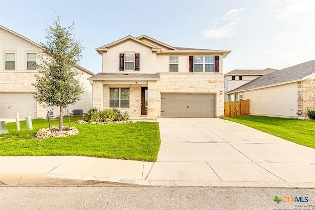 traditional home featuring driveway, a garage, fence, central air condition unit, and a front yard