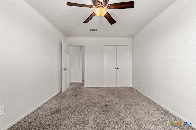 unfurnished bedroom with carpet floors and ceiling fan