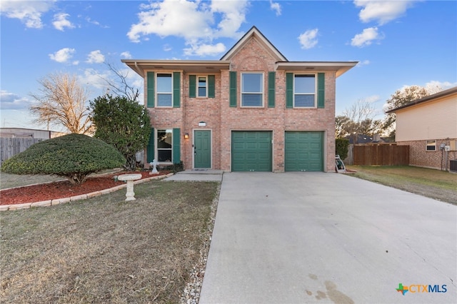 view of front of property featuring a garage and a front yard