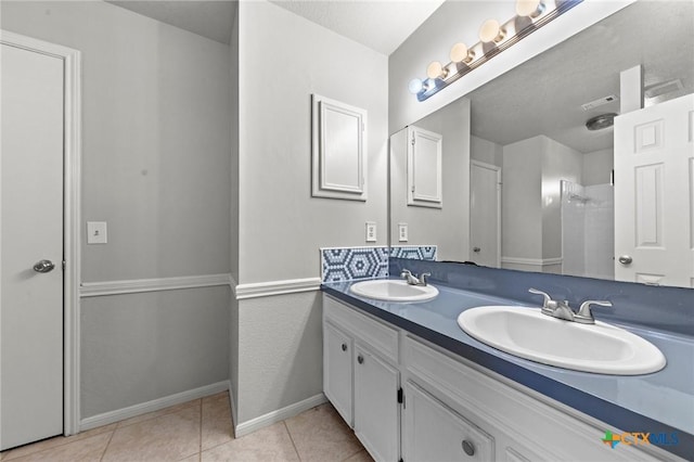 bathroom featuring vanity and tile patterned flooring