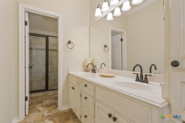 11421 Somerville Dr, Temple, TX 76502 - full bathroom featuring a shower stall, double vanity, a chandelier, and stone finish floors
