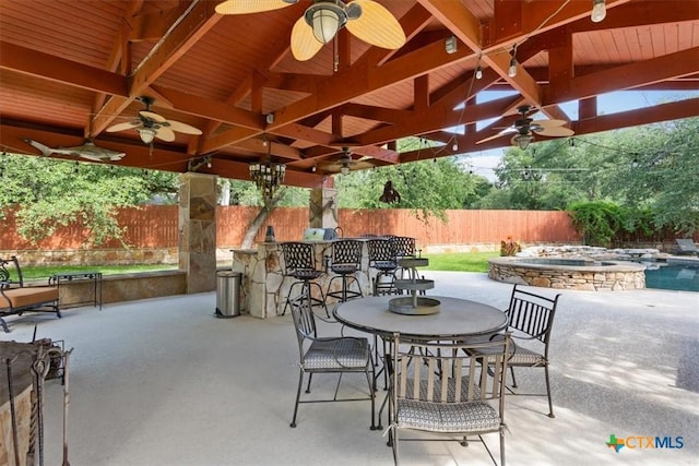 11421 Somerville Dr, Temple, TX 76502 - fenced backyard featuring ceiling fan, an outdoor bar, a patio area, and a pool with connected hot tub