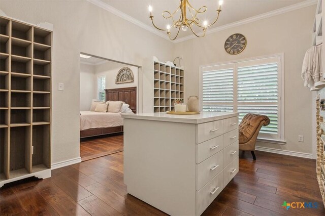 11421 Somerville Dr, Temple, TX 76502 - walk in closet featuring dark wood-style floors and a chandelier