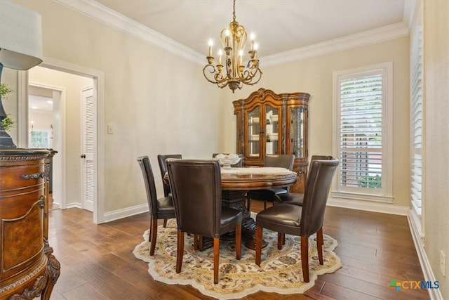 11421 Somerville Dr, Temple, TX 76502 - dining area with a chandelier, ornamental molding, plenty of natural light, and dark wood-type flooring