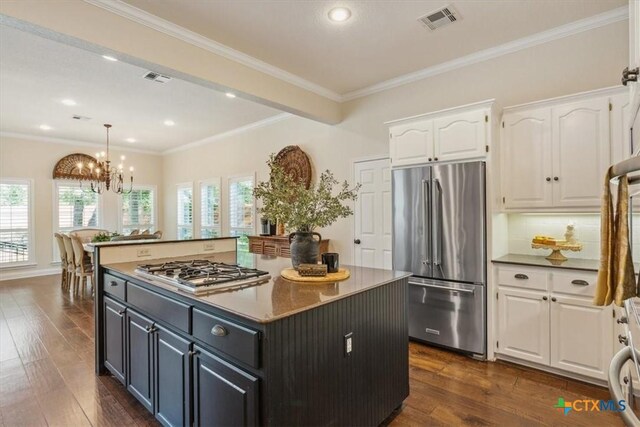 11421 Somerville Dr, Temple, TX 76502 - kitchen featuring stainless steel appliances, white cabinets, a kitchen island, dark wood-style flooring, and recessed lighting