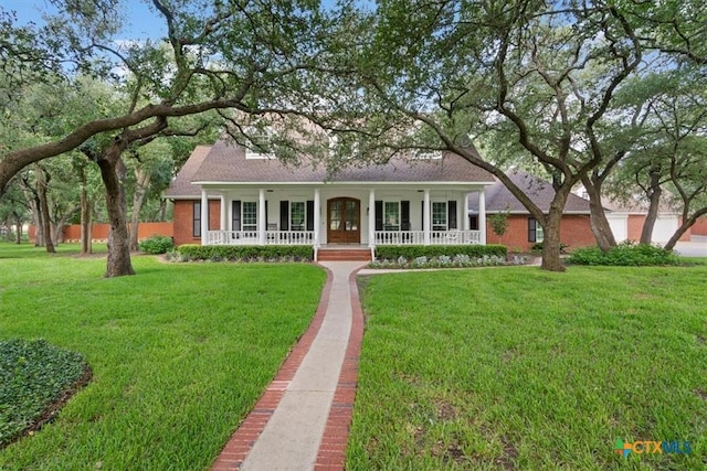 11421 Somerville Dr, Temple, TX 76502 - view of front of house featuring covered porch and a front lawn
