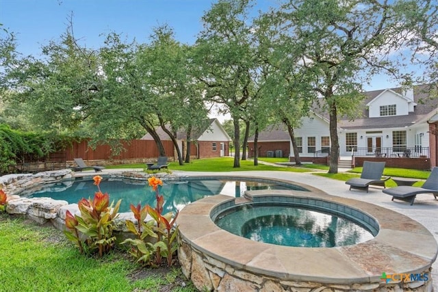 11421 Somerville Dr, Temple, TX 76502 - view of swimming pool featuring french doors, a patio, and a pool with connected hot tub