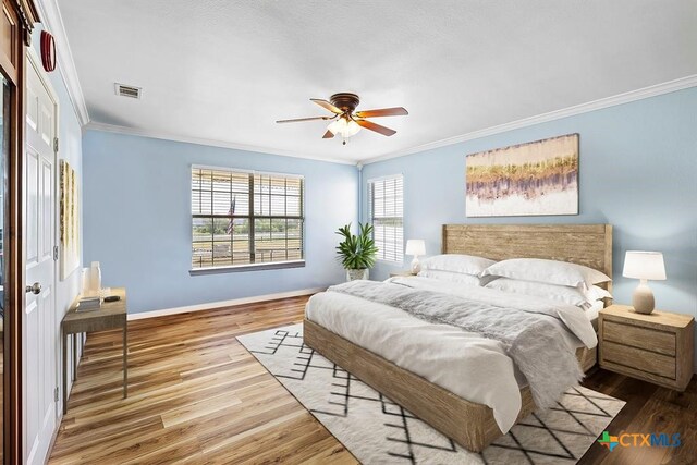3656 Fm 2657, Copperas Cove, TX 76539 - bedroom featuring visible vents, ornamental molding, baseboards, and wood finished floors