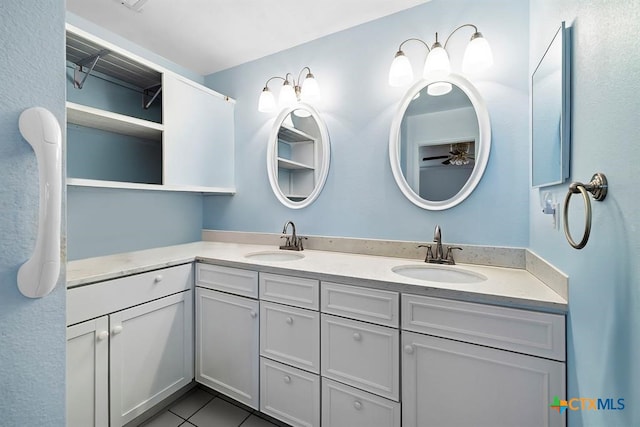 3656 Fm 2657, Copperas Cove, TX 76539 - bathroom with tile patterned flooring, double vanity, ceiling fan, and a sink