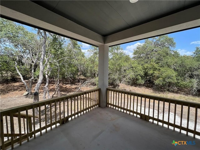 123 S Calvin Barrett, Blanco, TX 78606 - balcony featuring view of wooded area