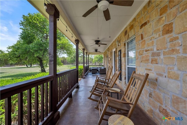 view of patio / terrace with a ceiling fan and covered porch