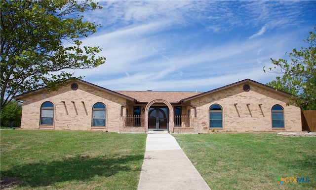 ranch-style house with a front yard