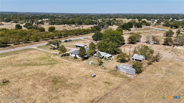 birds eye view of property featuring a rural view