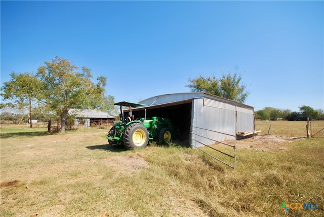 view of outdoor structure featuring a rural view