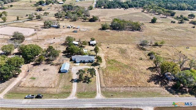 birds eye view of property featuring a rural view