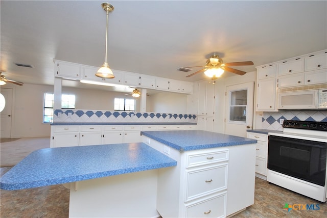 kitchen featuring backsplash, hanging light fixtures, white appliances, a center island, and white cabinets