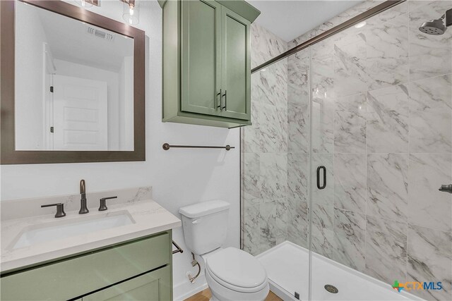 4146 Turning Leaf Dr, Nolanville, TX 76559 - bathroom featuring visible vents, a stall shower, toilet, and vanity