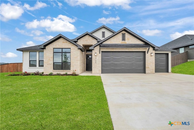 4146 Turning Leaf Dr, Nolanville, TX 76559 - view of front of property featuring fence, an attached garage, a front lawn, stone siding, and driveway