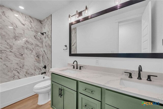 4146 Turning Leaf Dr, Nolanville, TX 76559 - full bathroom featuring double vanity, a sink, wood finished floors, and toilet