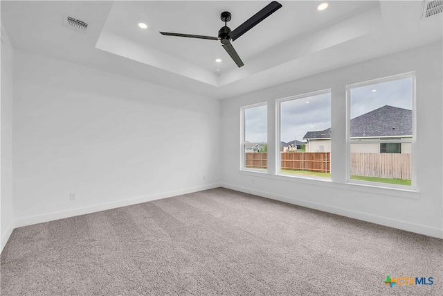 4146 Turning Leaf Dr, Nolanville, TX 76559 - empty room with baseboards, a ceiling fan, a tray ceiling, and carpet flooring