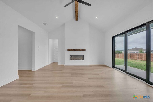 4146 Turning Leaf Dr, Nolanville, TX 76559 - unfurnished living room with ceiling fan, high vaulted ceiling, a glass covered fireplace, light wood-type flooring, and beamed ceiling