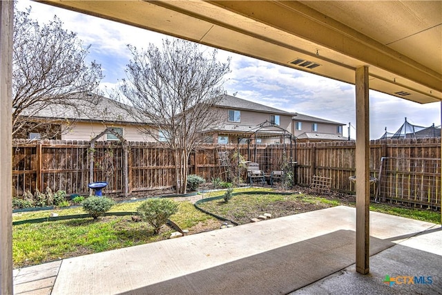 view of patio featuring fence