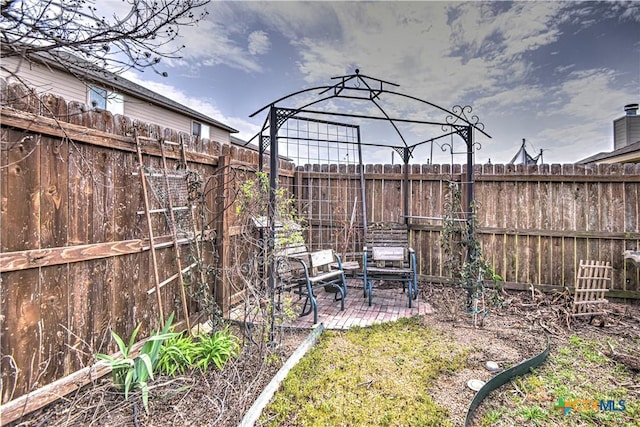 view of yard featuring a patio and a fenced backyard