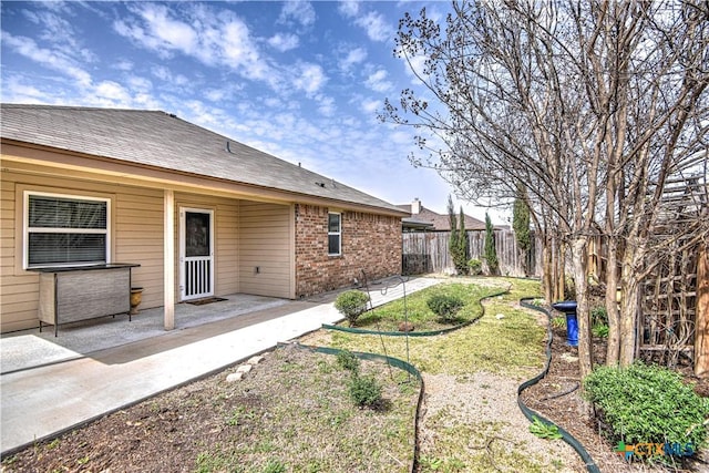 view of yard with a patio area and a fenced backyard