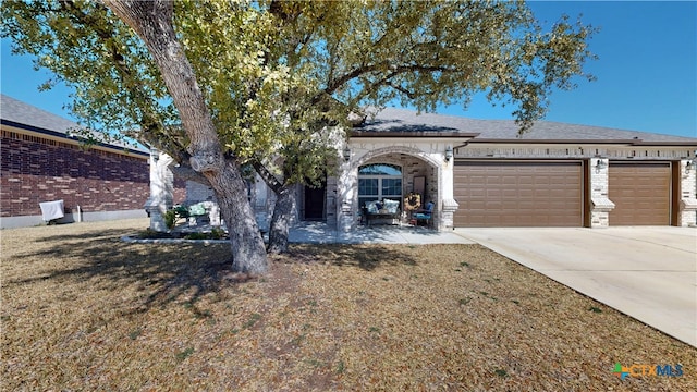 view of front facade featuring a garage and concrete driveway