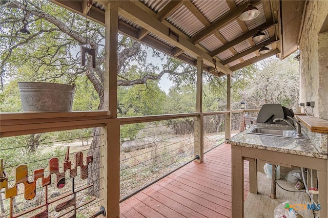 wooden deck featuring sink