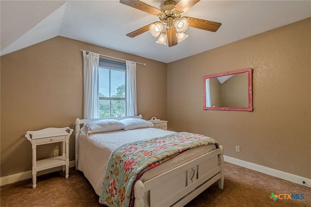 bedroom featuring vaulted ceiling, ceiling fan, and dark colored carpet