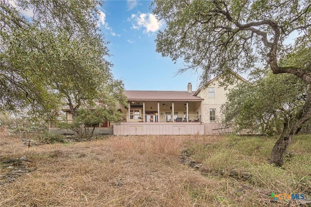 back of house with a porch