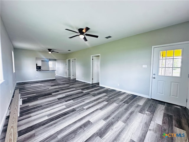 unfurnished living room with hardwood / wood-style floors and ceiling fan