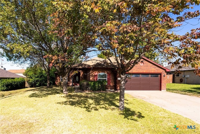 ranch-style home with a garage and a front yard