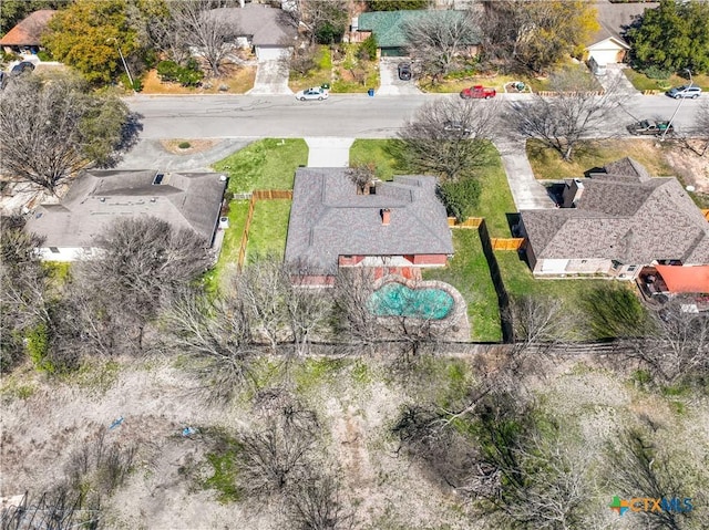 birds eye view of property with a residential view