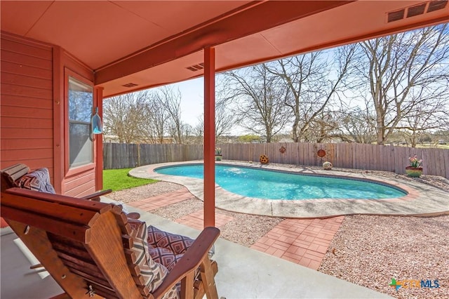 view of swimming pool with a fenced in pool, a patio, and a fenced backyard