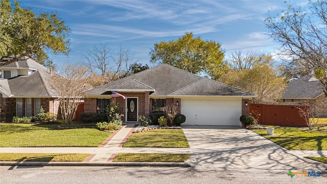 ranch-style home featuring a garage and a front lawn