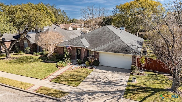 view of front of home with a garage and a front yard