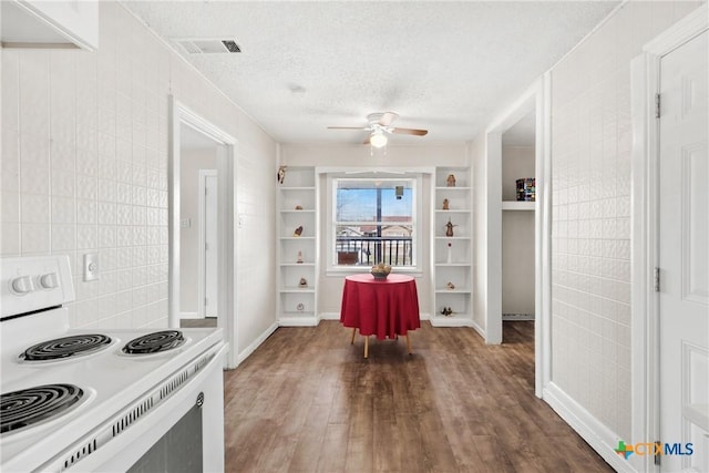 kitchen featuring visible vents, white electric range, a ceiling fan, a textured ceiling, and wood finished floors