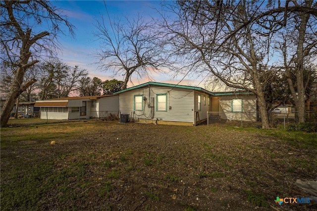 exterior space with fence and a yard