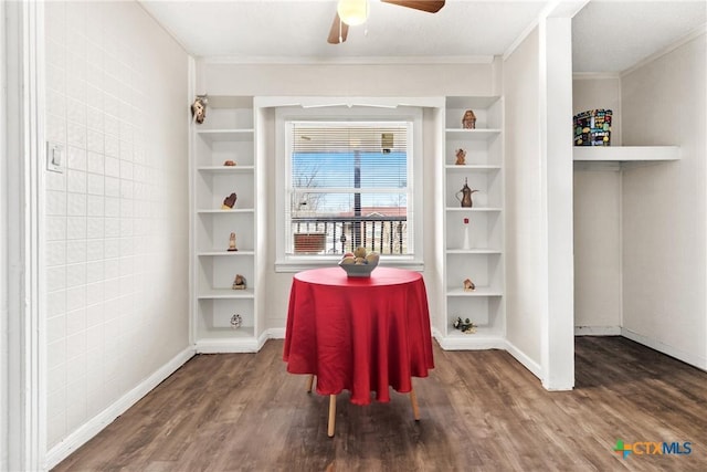 living area with ceiling fan, ornamental molding, wood finished floors, and built in features