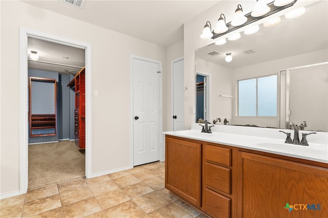 bathroom with tile patterned flooring and vanity