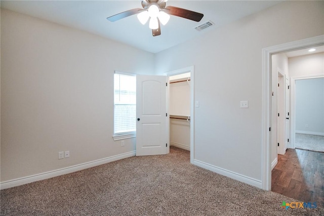 3611 Hanselman Rd, Victoria, TX 77901 - unfurnished bedroom featuring carpet flooring, ceiling fan, and a walk in closet