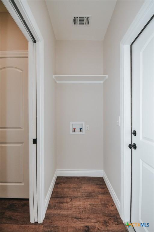 3611 Hanselman Rd, Victoria, TX 77901 - washroom featuring dark wood-type flooring and washer hookup
