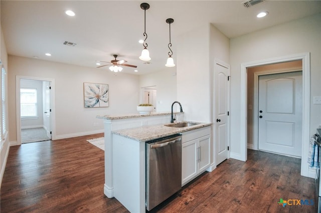 3611 Hanselman Rd, Victoria, TX 77901 - kitchen featuring dishwasher, ceiling fan, hanging light fixtures, dark wood finished floors, and white cabinetry