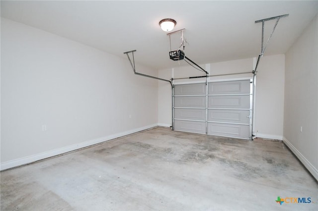 3611 Hanselman Rd, Victoria, TX 77901 - garage with a garage door opener and baseboards