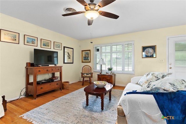 bedroom with ceiling fan and light wood-type flooring