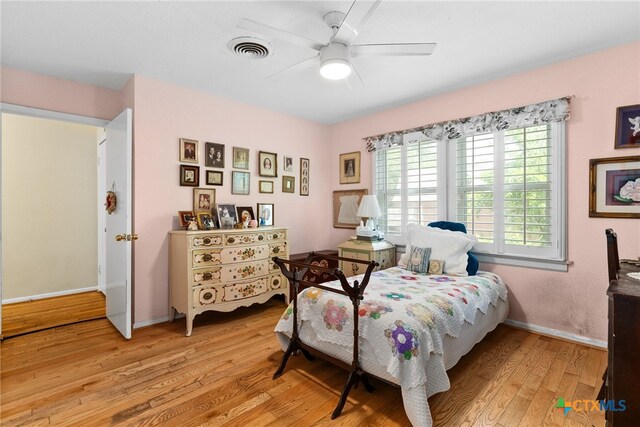 bedroom featuring ceiling fan and light hardwood / wood-style flooring