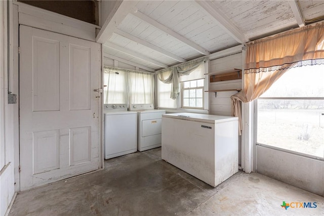 washroom with washer and dryer